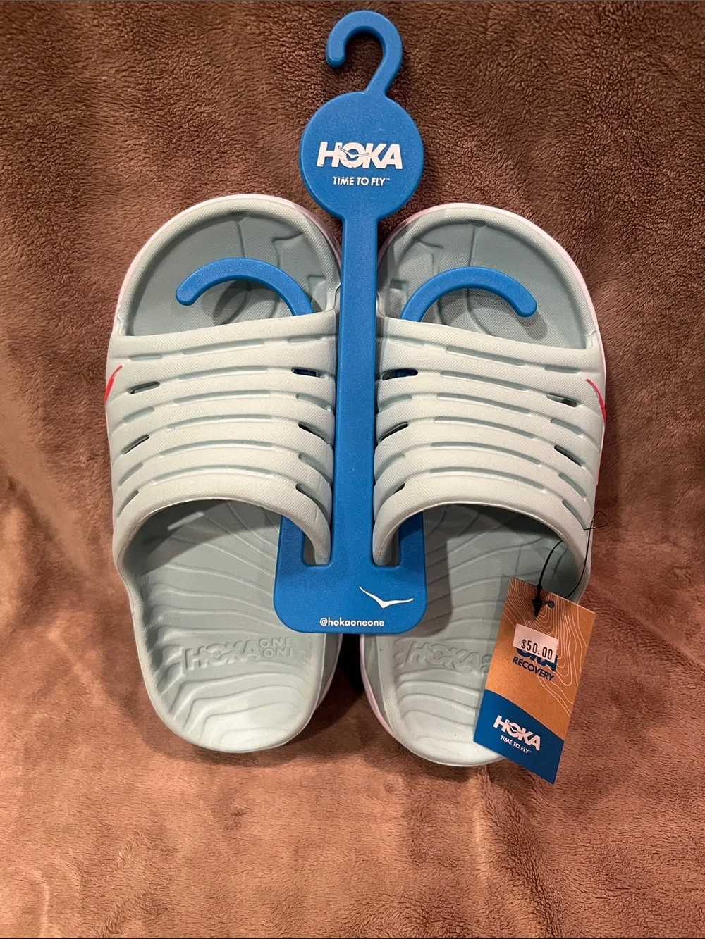 Hoka Slide Sandals in Light Egghell Blue with Pink Accent